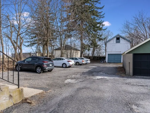 a view of a car parked in front of house