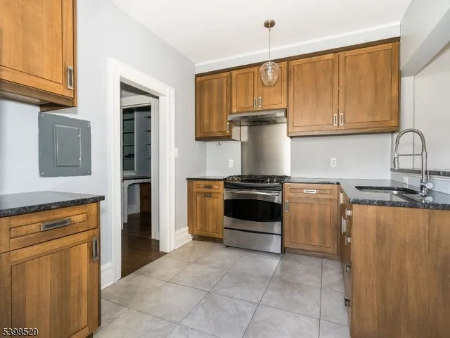 a kitchen with a stove and a refrigerator