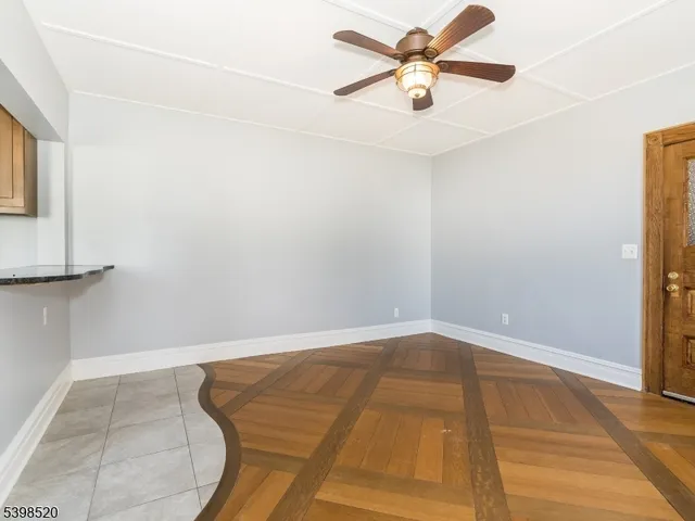 a view of a room with a ceiling fan