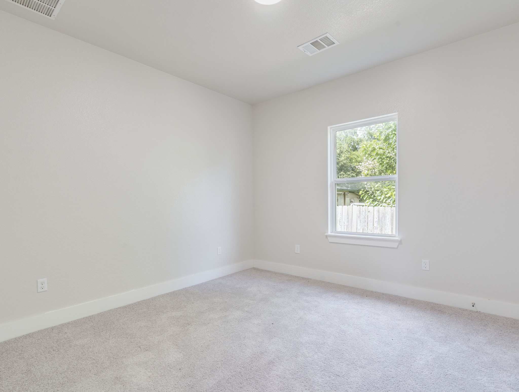 411 South Ave B Elgin, TX 78621 - Photo 11 of 23 an empty room with a window