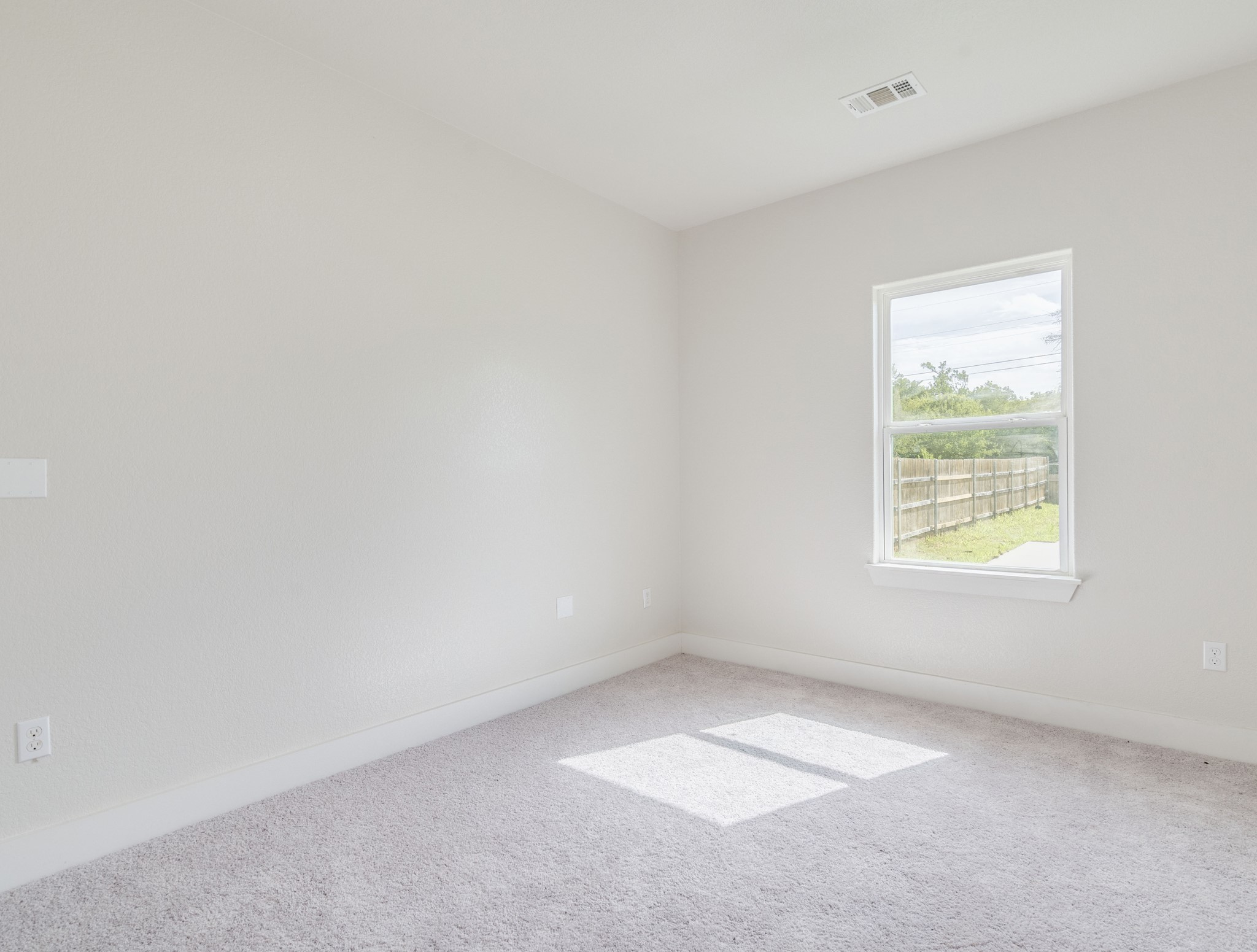 411 South Ave B Elgin, TX 78621 - Photo 13 of 23 an empty room with a window