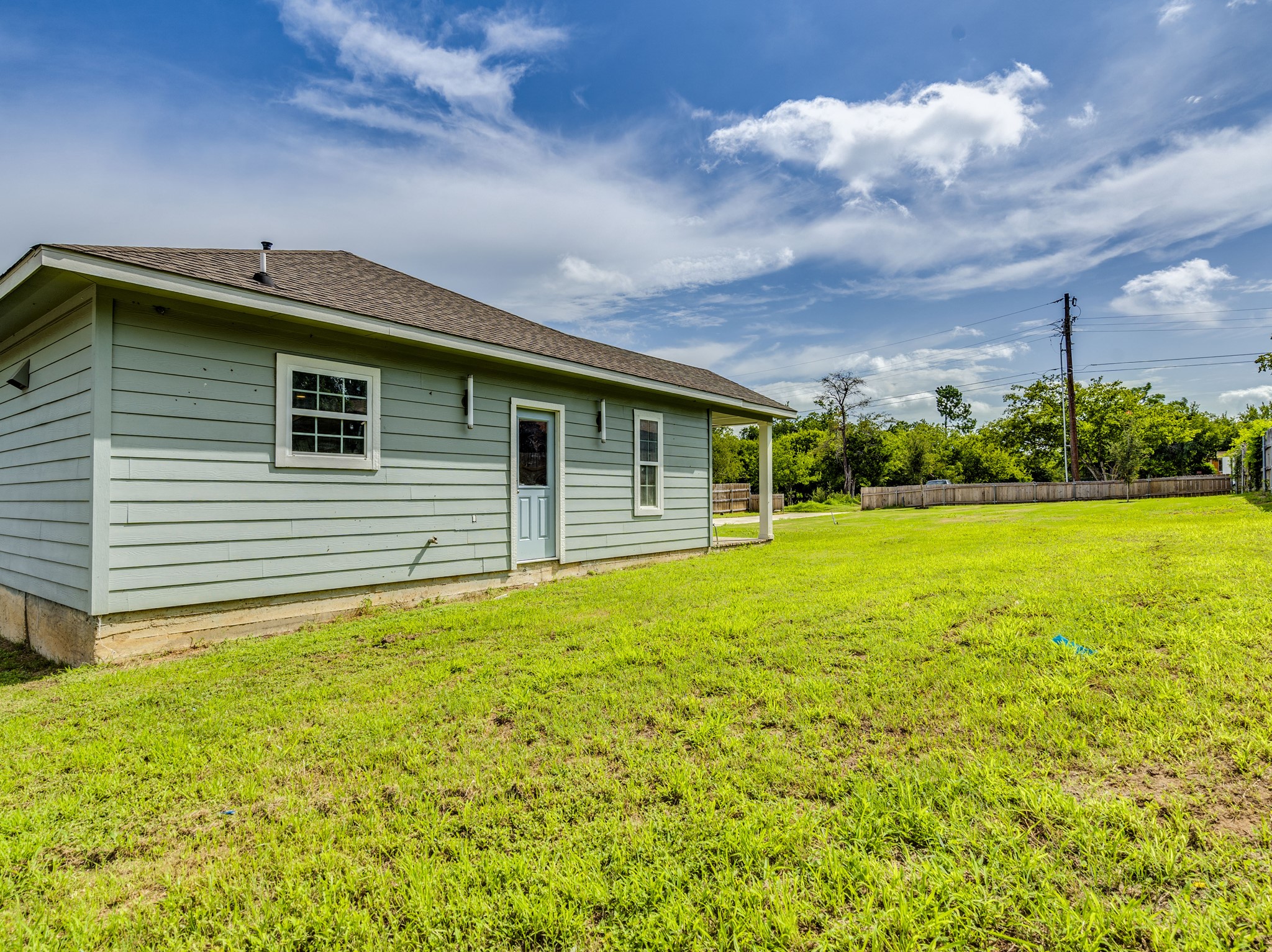 411 South Ave B Elgin, TX 78621 - Photo 19 of 23 a front view of house with yard and green space