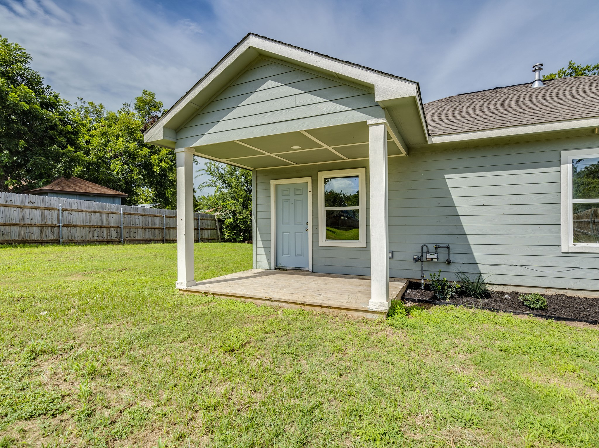 411 South Ave B Elgin, TX 78621 - Photo 20 of 23 a view of a house with backyard and porch