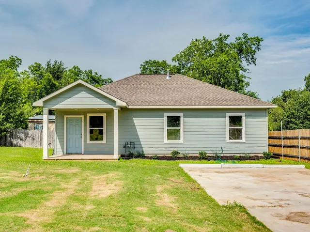 a front view of a house with yard