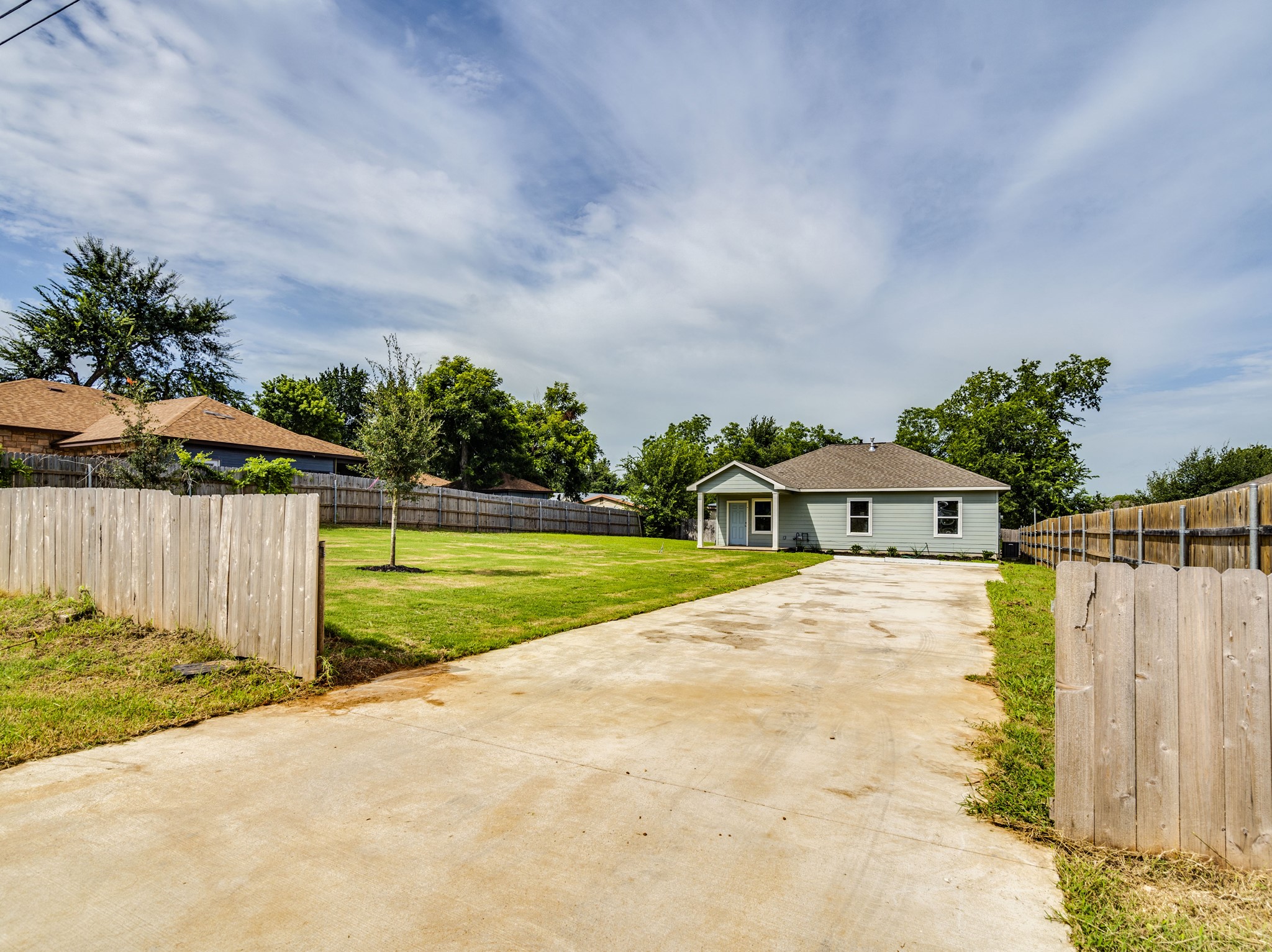 411 South Ave B Elgin, TX 78621 - Photo 21 of 23 a front view of a house with a yard