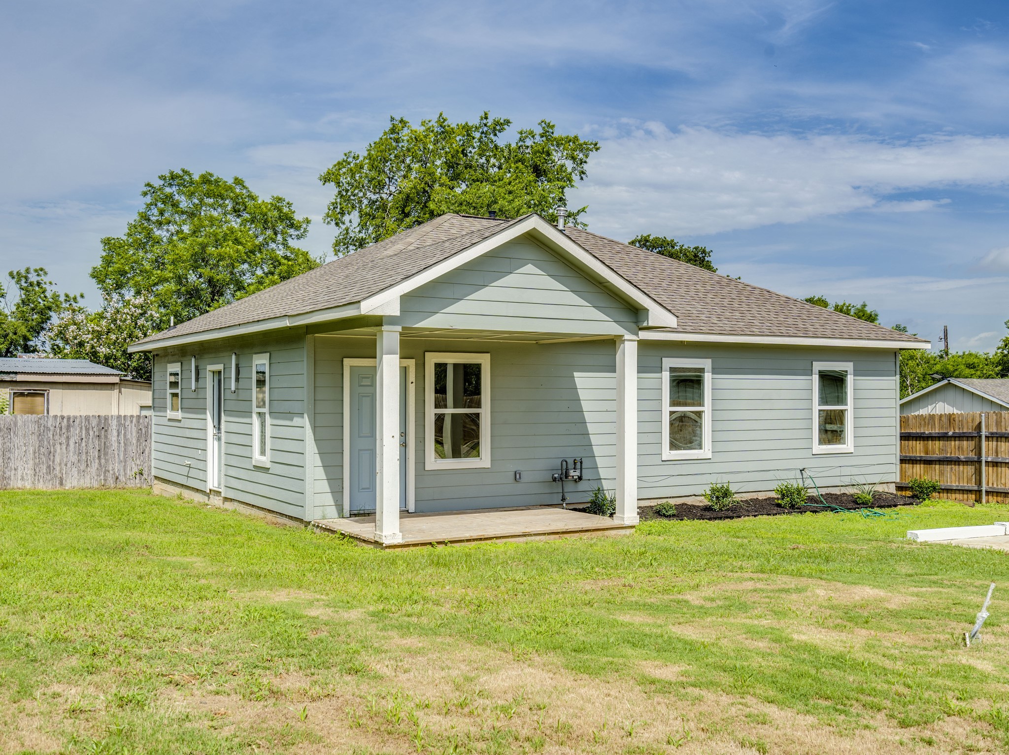 411 South Ave B Elgin, TX 78621 - Photo 22 of 23 a front view of house with yard and green space