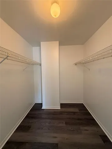 a bathroom with a toilet a sink a mirror and a bathtub