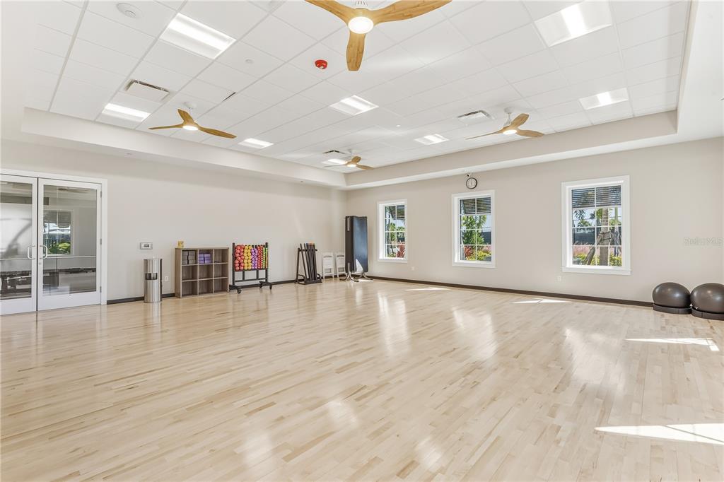4319 Fence Row Court Lakewood Ranch, FL 34211 - Photo 35 of 39 a view of an empty room with wooden floor and a window