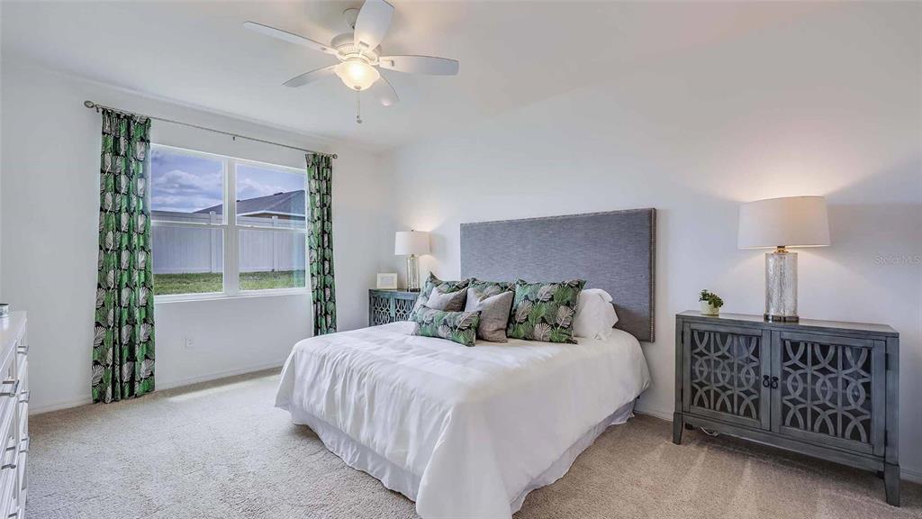 4319 Fence Row Court Lakewood Ranch, FL 34211 - Photo 7 of 39 a bedroom with a bed and a window