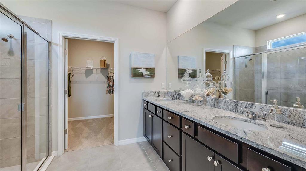 4319 Fence Row Court Lakewood Ranch, FL 34211 - Photo 8 of 39 a bathroom with a granite countertop sink mirror and double