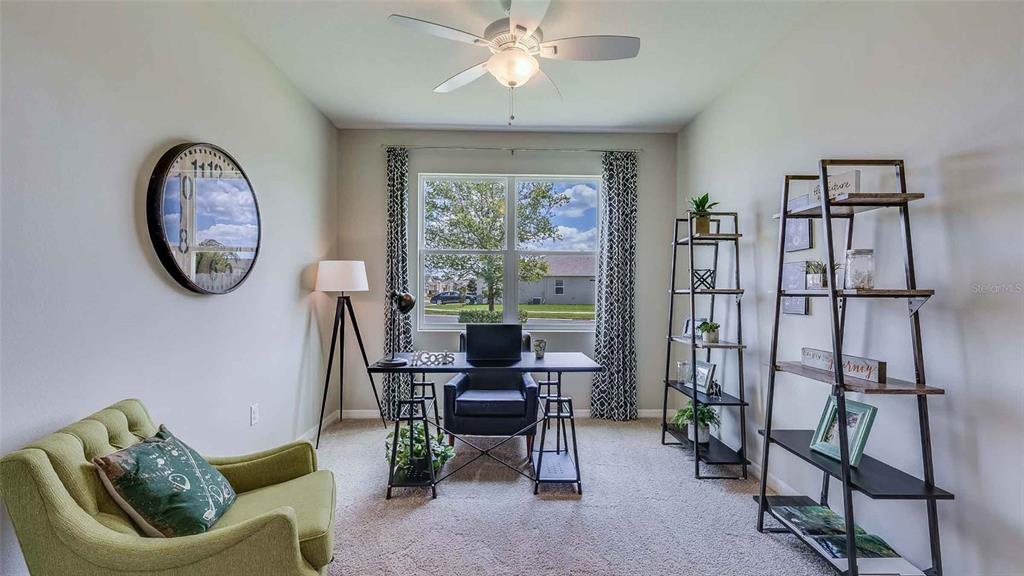 4319 Fence Row Court Lakewood Ranch, FL 34211 - Photo 10 of 39 a view of a livingroom with furniture and a window