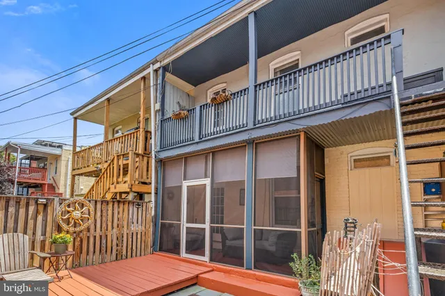 a view of a balcony with wooden floor