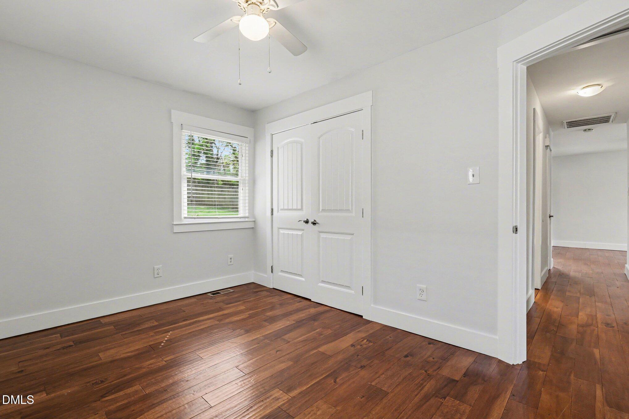 727 South State Street Raleigh, NC 27601 - Photo 19 of 30 an empty room with wooden floor and windows