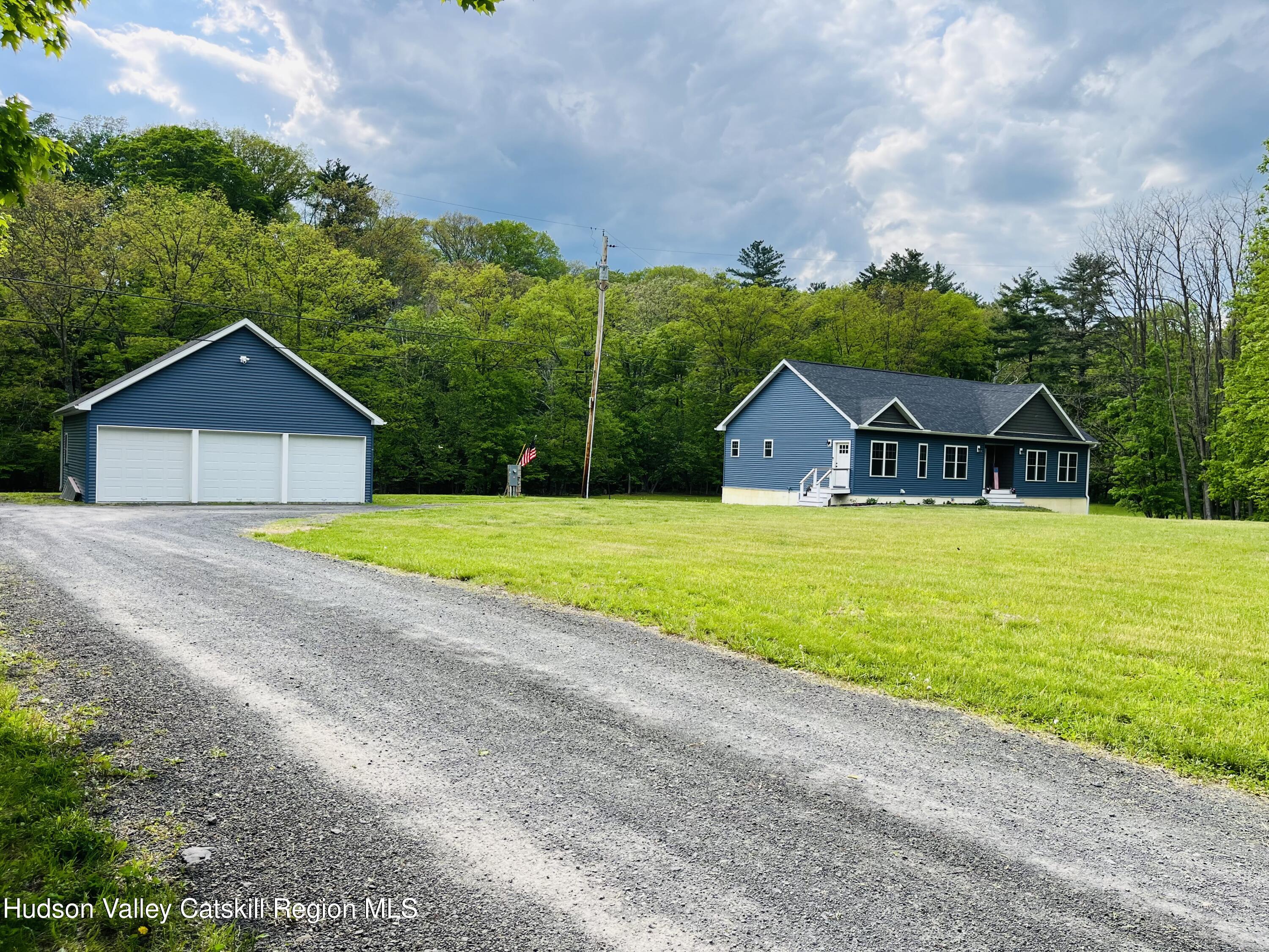 685 Sandy Plains Road Athens, NY 12451 - Photo 26 of 37 a view of a house with swimming pool and a yard