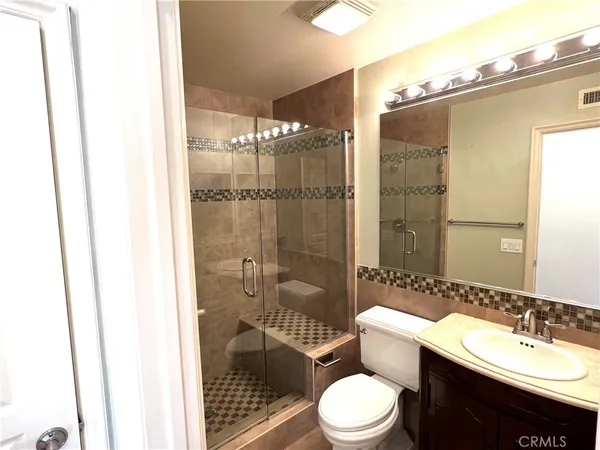 a bathroom with a sink and mirror