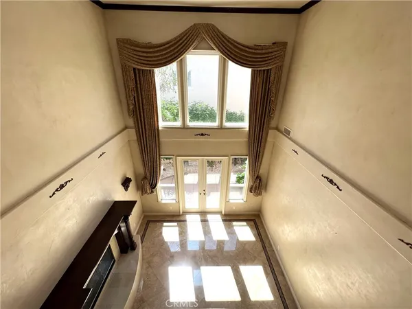 a view of walk in closet with empty room