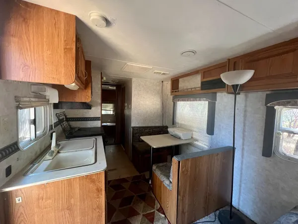 a view of yard covered with snow in front of house