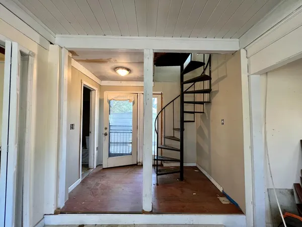 a view of entryway with stairs and wooden floor