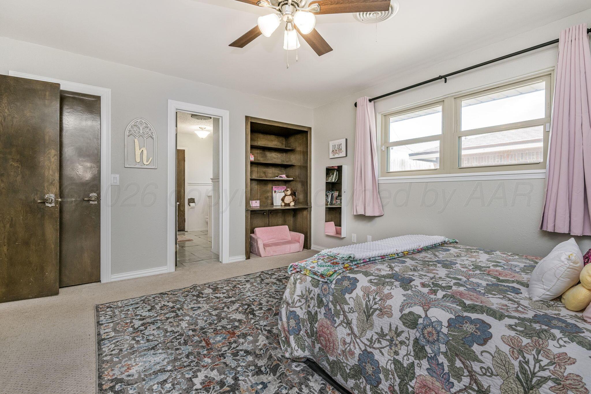 801 Arrah Friona, TX 79035 - Photo 21 of 37 a bedroom with a bed dresser and a window