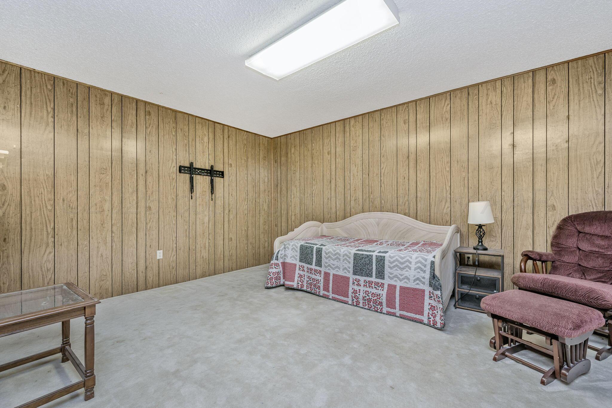 801 Arrah Friona, TX 79035 - Photo 28 of 37 a bedroom with a bed and a chair