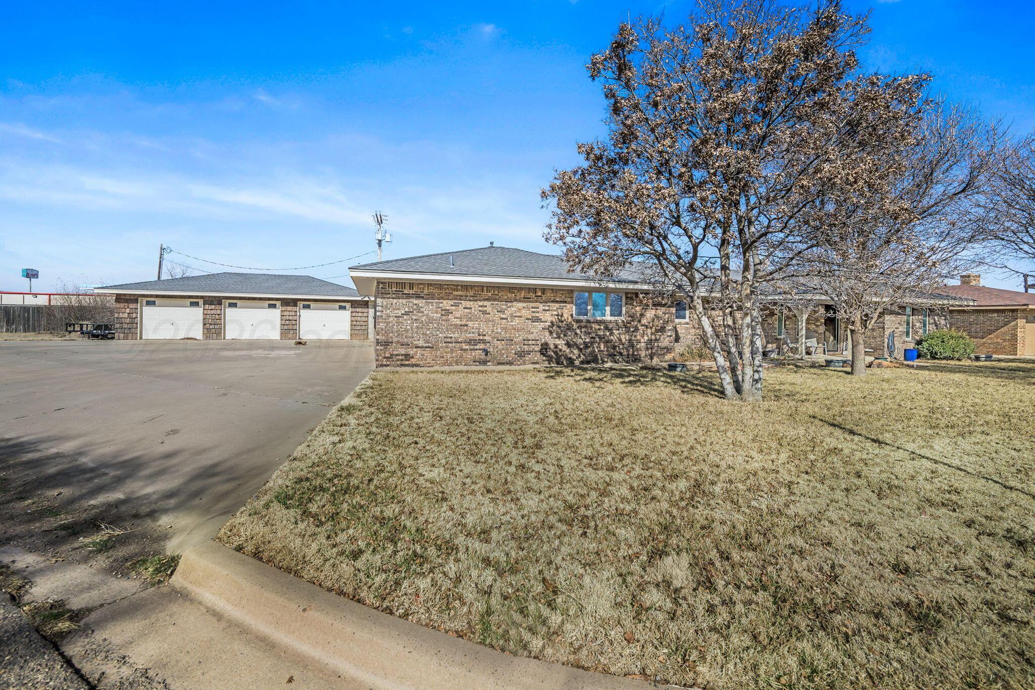 801 Arrah Friona, TX 79035 - Photo 36 of 37 a front view of a house with large trees