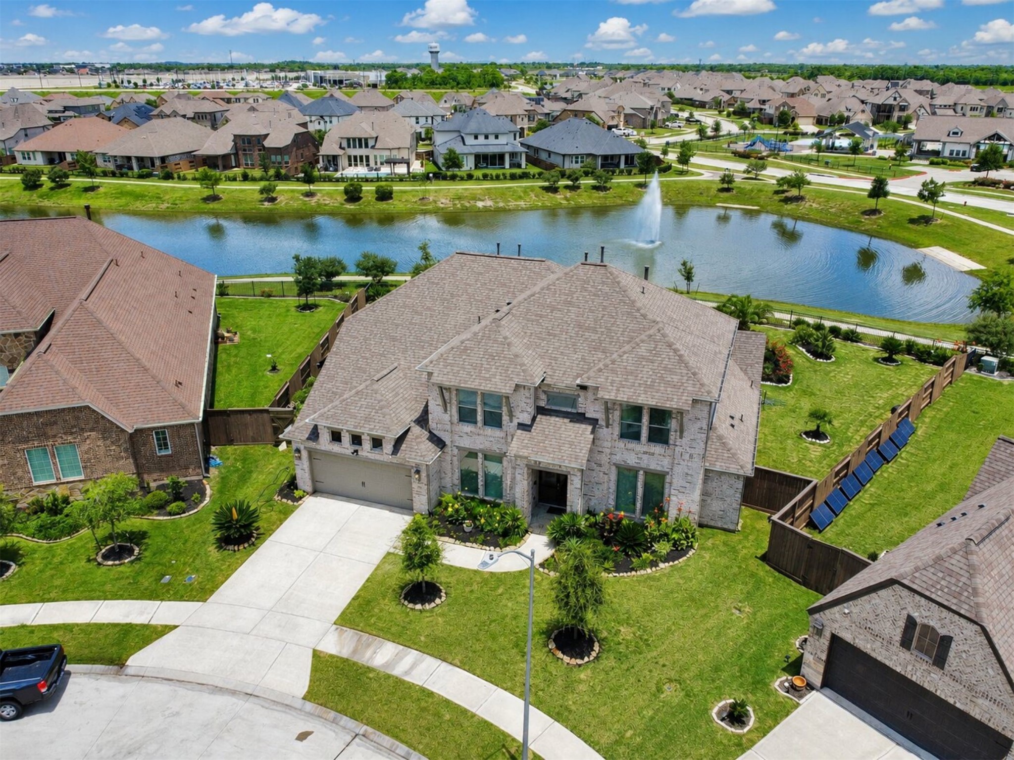 4343 Martin Ridge Drive Manvel, TX 77578 - Photo 1 of 50 an aerial view of a house with a garden and lake view