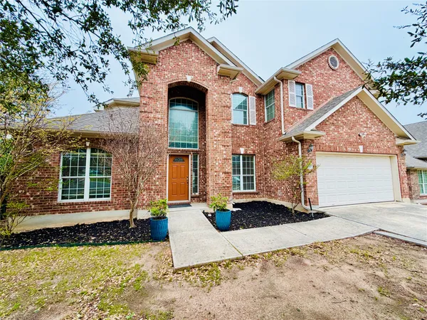 a view of a hallway with wooden floor and stairs