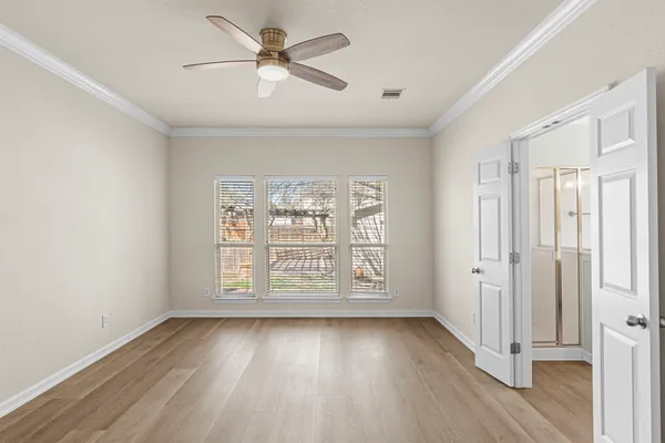 a bathroom with a double vanity sink a mirror and a bathtub