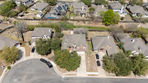 a view of a backyard with a wooden deck