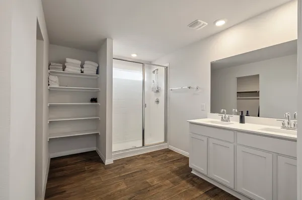 a view with cabinets and wooden floor