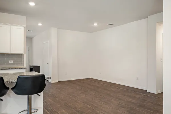 a view of kitchen with a sink cabinets and wooden floor