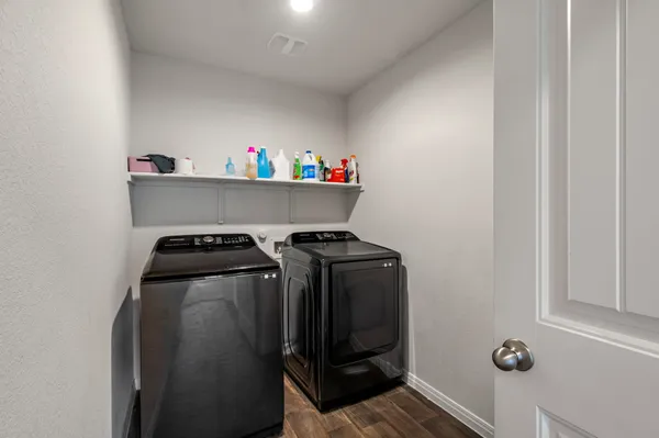 a utility room with dryer and washer