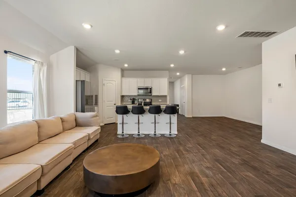 a living room with furniture and a table