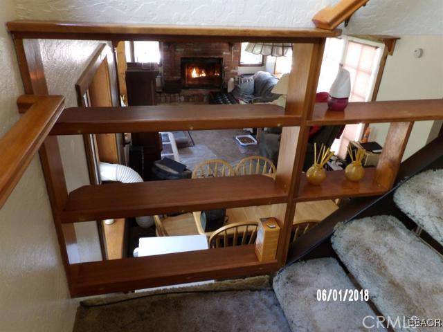 24024 Bowl Road Crestline, CA 92325 - Photo 6 of 27 a view of a porch with seating area