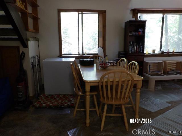 24024 Bowl Road Crestline, CA 92325 - Photo 8 of 27 a view of a dining room with furniture and window