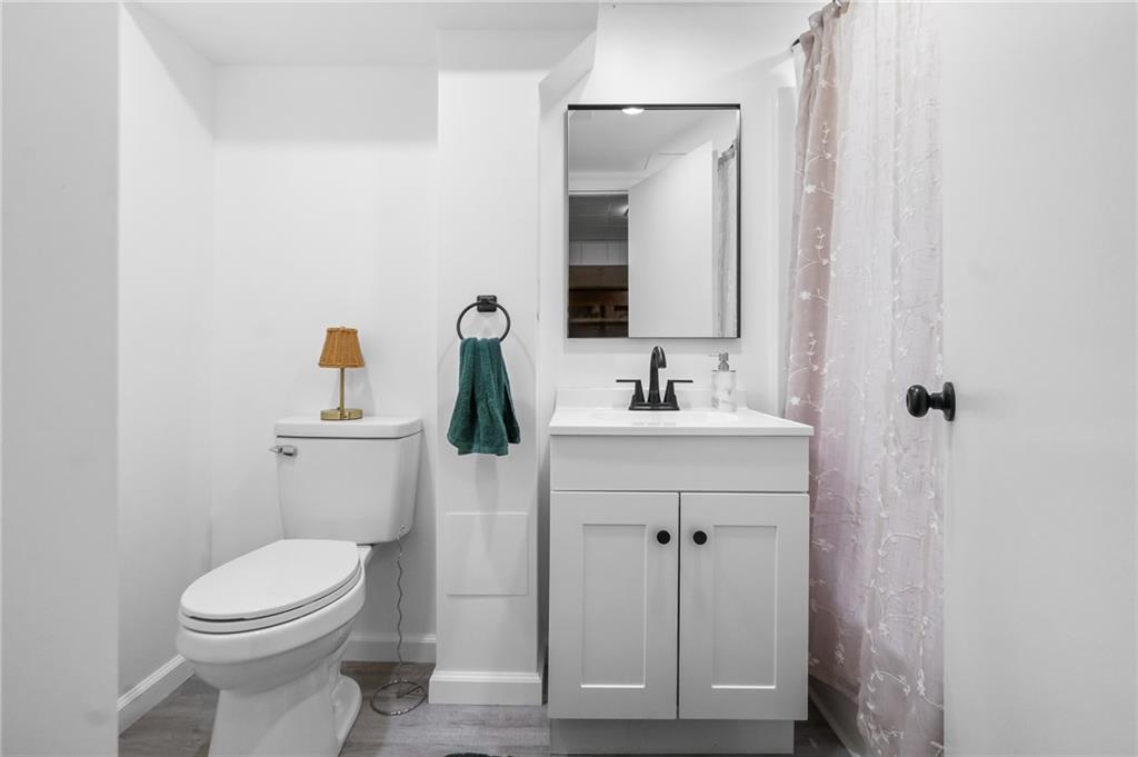 1654 Hollyrood Road Pittsburgh, PA 15227 - Photo 29 of 33 a bathroom with a toilet sink and mirror