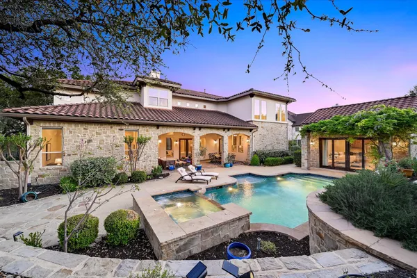 a front view of house with yard and outdoor seating