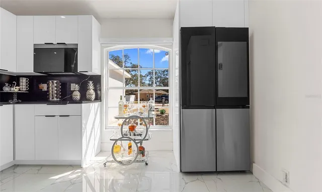 a view of living room with furniture and flat screen tv