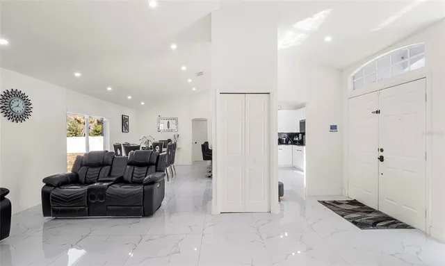 a living room with furniture and a rug
