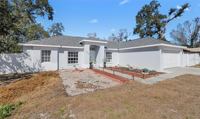 a view of a house with a snow in the yard