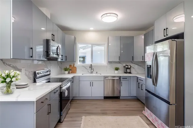 a kitchen with a sink stove and refrigerator