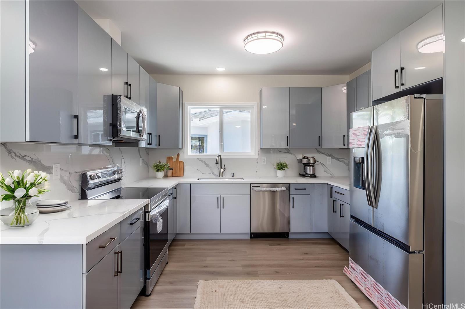839 Oneawa Street Kailua, HI 96734 - Photo 12 of 14 a kitchen with a sink stove and refrigerator