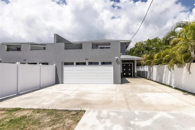 a view of a house with a garage