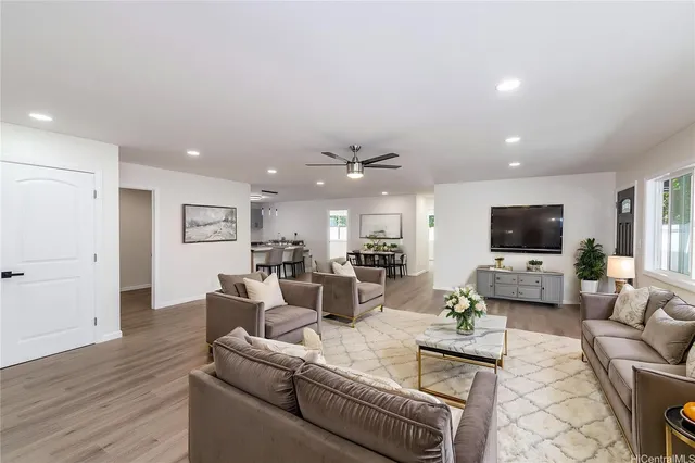 a living room with furniture and a flat screen tv