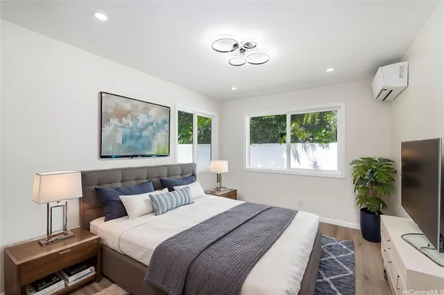 a bedroom with bed and a window