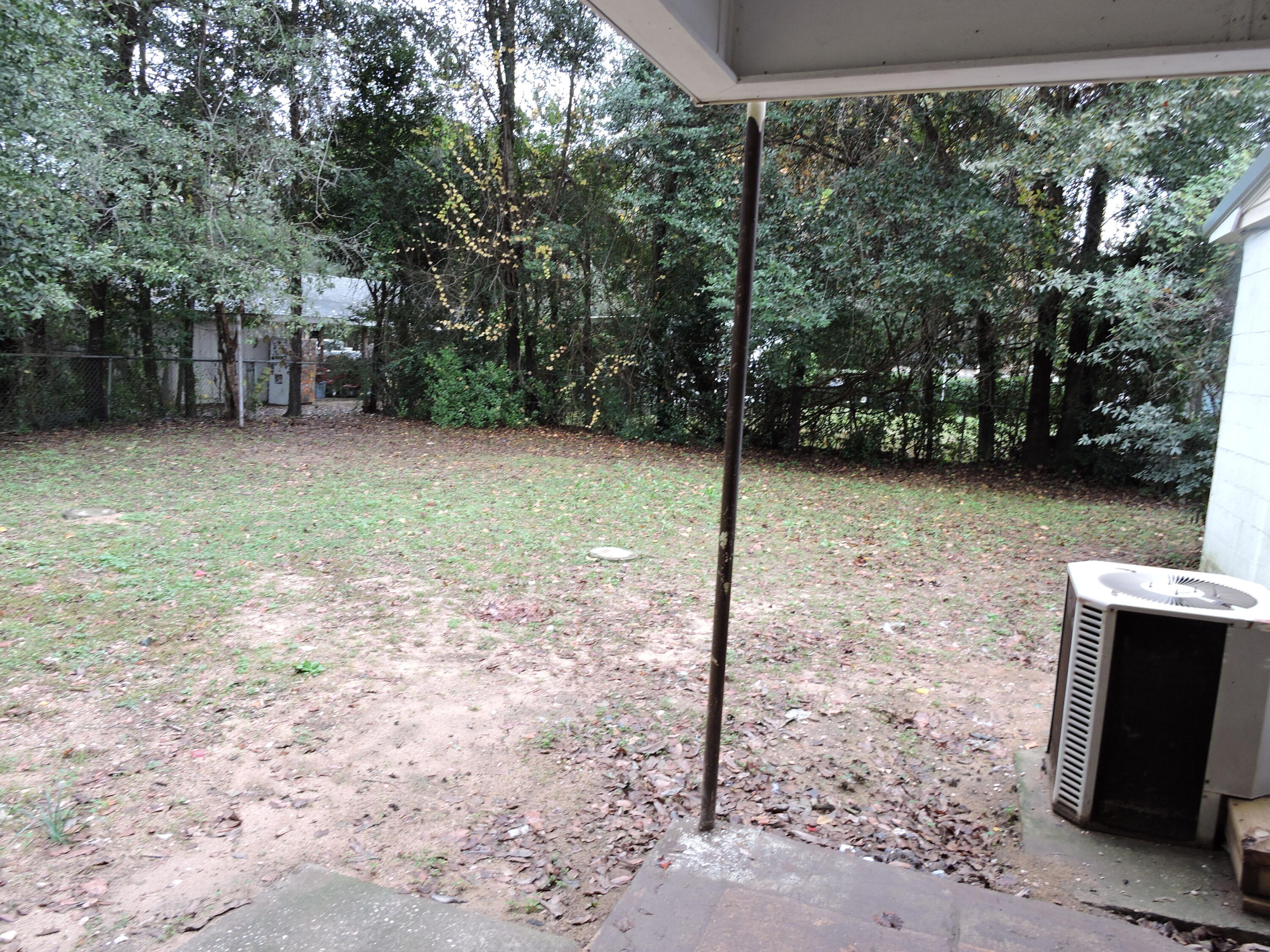 120 Sikes Drive Crestview, FL 32539 - Photo 18 of 18 a backyard of a house with lots of green space