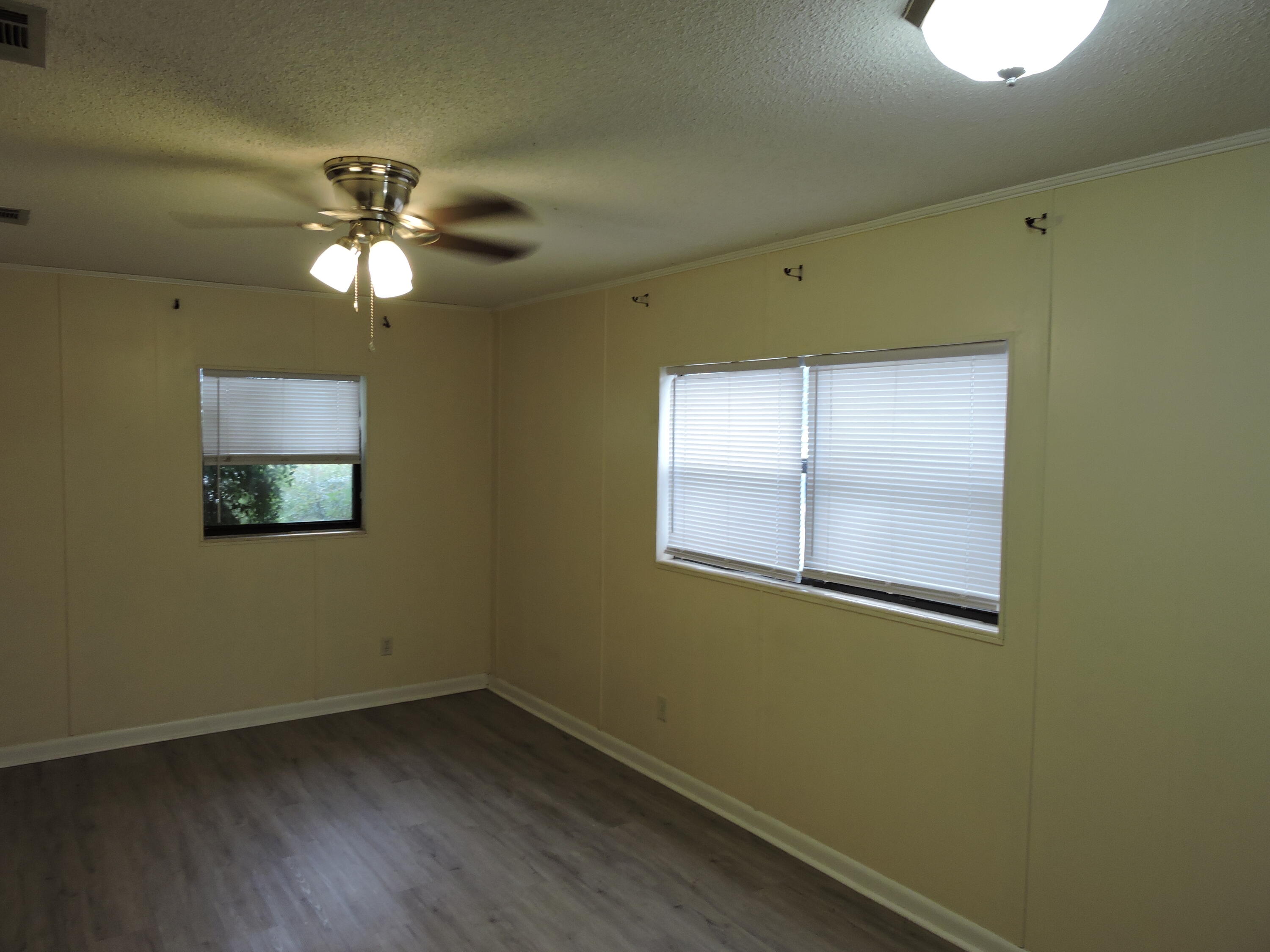 120 Sikes Drive Crestview, FL 32539 - Photo 2 of 18 an empty room with a window