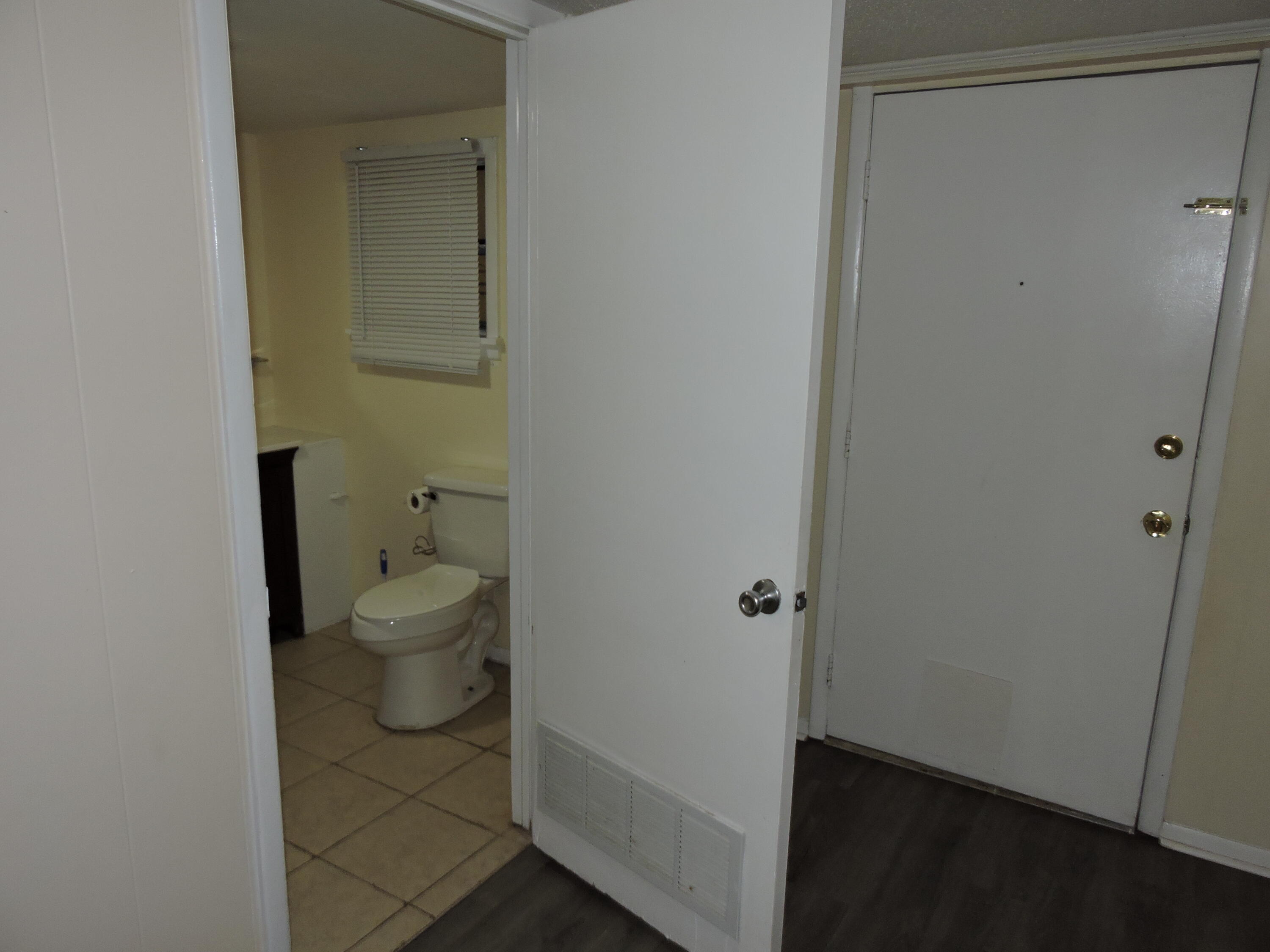 120 Sikes Drive Crestview, FL 32539 - Photo 8 of 18 a white toilet sitting next to a sink
