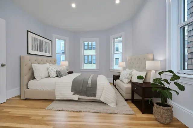 a living room with furniture flowerpot and a window