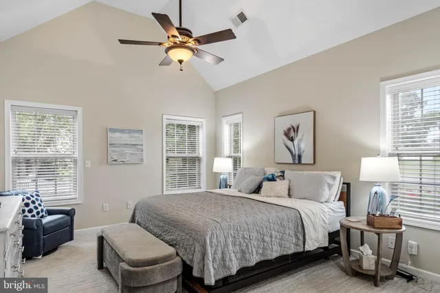 a bedroom with a bed and a couch